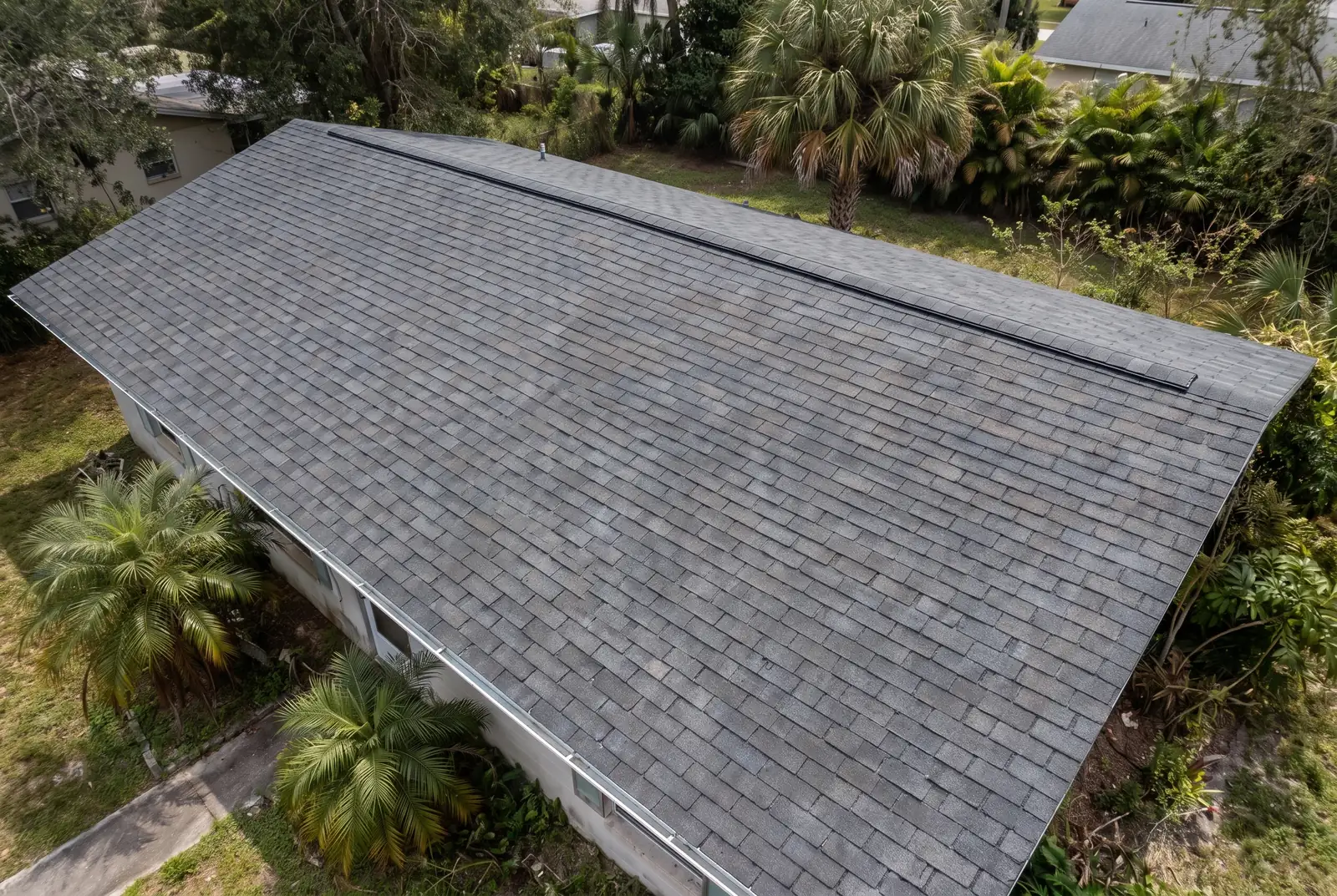 The same roof after replacement with new architectural shingle